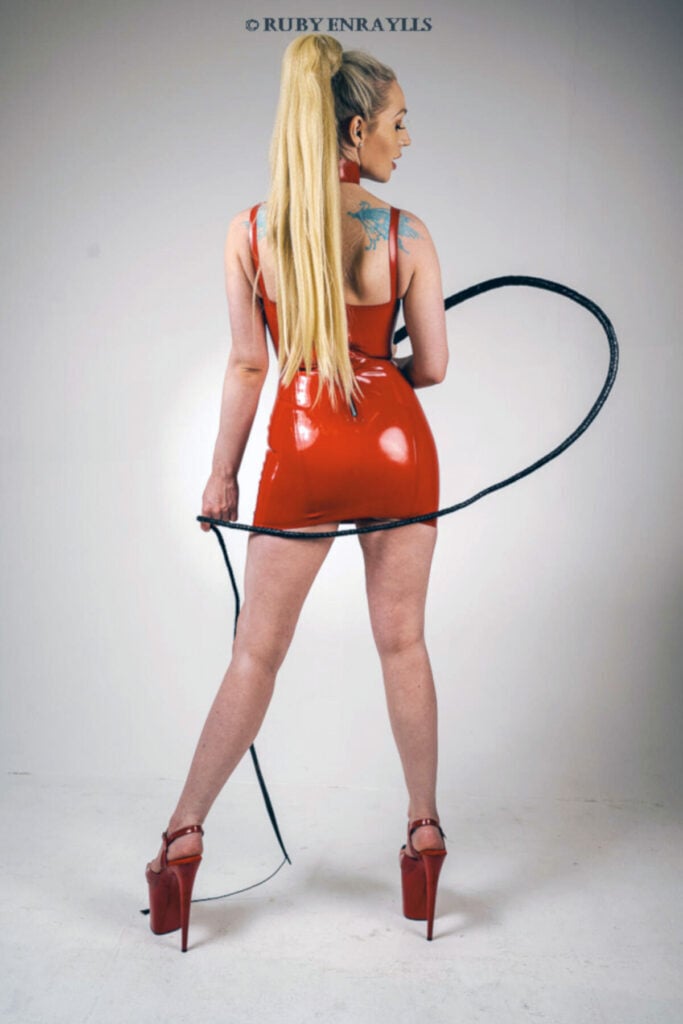 Seattle latex fetish mistress ruby enraylls wears a red latex dress