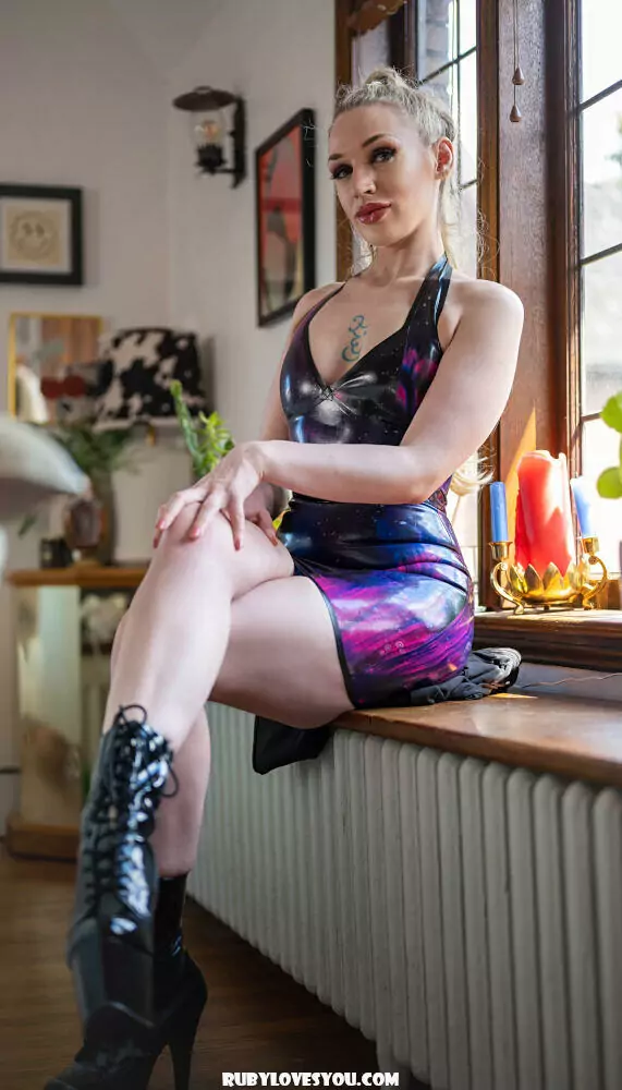 Seattle Dominatrix Ruby Enraylls wears galaxy print latex dress and fetish boots, meet a dominatrix near you